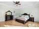 Spacious main bedroom with detailed wood furnishings, tray ceiling, and ensuite bathroom at 1391 Royston Rd, Mount Pleasant, SC 29464