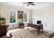 Bright office featuring detailed trimwork, wooden desk, and large windows overlooking the green landscape at 1391 Royston Rd, Mount Pleasant, SC 29464