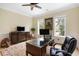 Sunlit office with stylish wooden furniture, a decorative rug, and a picturesque outdoor view at 1391 Royston Rd, Mount Pleasant, SC 29464
