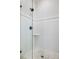 Tiled shower featuring a glass door, white subway tile with decorative accents, and a mosaic tile floor at 1391 Royston Rd, Mount Pleasant, SC 29464