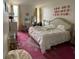 Bright bedroom with a floral rug, large bed, vanity table, and modern décor gives a cozy feel at 14 Lockwood Dr # 6I, Charleston, SC 29401