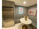Charming kitchen nook featuring modern appliances and coastal-themed artwork and decor at 14 Lockwood Dr # 6I, Charleston, SC 29401