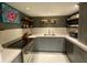 Well-lit kitchen with gray cabinetry, modern appliances and a stainless steel range at 14 Lockwood Dr # 6I, Charleston, SC 29401