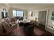 Bright living room offering natural light, chic decor, and stunning city views at 14 Lockwood Dr # 6I, Charleston, SC 29401
