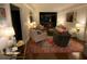 Comfortable living room featuring a patterned rug, sofa, chairs, lamps, and other decor at 14 Lockwood Dr # 6I, Charleston, SC 29401