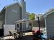 Backyard patio with dining set, large umbrella, and outdoor seating, perfect for enjoying the outdoors at 1418 Whispering Oak Trl, Mount Pleasant, SC 29466