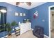 bedroom with bright blue walls, neutral carpet and white dresser and decor at 1418 Whispering Oak Trl, Mount Pleasant, SC 29466