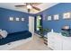 Stylish blue bedroom featuring neutral carpet and a comfy bed, dresser, and decor at 1418 Whispering Oak Trl, Mount Pleasant, SC 29466