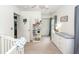 Well-organized Bedroom with crib, dresser, bookshelf and view to entry door and closet at 1418 Whispering Oak Trl, Mount Pleasant, SC 29466