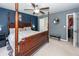 Well-lit bedroom with four-poster bed, closet, and comfortable seating, creating a relaxing and inviting space at 1418 Whispering Oak Trl, Mount Pleasant, SC 29466