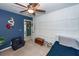 Nicely decorated room with blue accent wall, small chair, and chest at 1418 Whispering Oak Trl, Mount Pleasant, SC 29466