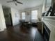 Bright dining room with a fireplace, contemporary decor, and lots of light from large windows at 1418 Whispering Oak Trl, Mount Pleasant, SC 29466