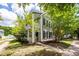 Beautiful two-story home with a welcoming porch and well-maintained landscaping at 1418 Whispering Oak Trl, Mount Pleasant, SC 29466