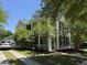 Two-story home with a inviting front porch, complimented by lush landscaping and a private driveway at 1418 Whispering Oak Trl, Mount Pleasant, SC 29466