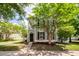 Charming two-story home with a welcoming porch and well-maintained landscaping at 1418 Whispering Oak Trl, Mount Pleasant, SC 29466
