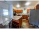 Well-lit kitchen featuring an island, stainless steel appliances, and warm wood cabinetry at 1418 Whispering Oak Trl, Mount Pleasant, SC 29466