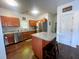 Well-equipped kitchen featuring an island, stainless steel appliances, and warm wood cabinets at 1418 Whispering Oak Trl, Mount Pleasant, SC 29466