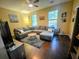 Inviting living room featuring comfortable seating, a ceiling fan, and plenty of natural light at 1418 Whispering Oak Trl, Mount Pleasant, SC 29466