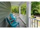 Inviting porch with chairs, providing a cozy outdoor seating area with views of the lush surroundings at 1418 Whispering Oak Trl, Mount Pleasant, SC 29466