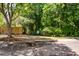 Street view of property featuring a wooded fence and foliage at 1418 Whispering Oak Trl, Mount Pleasant, SC 29466