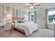 Serene bedroom with a striped accent wall, a comfortable bed, and plenty of natural light at 142 Seaton St, Summerville, SC 29486