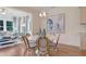 Bright dining area with a round table, stylish chairs, a modern chandelier, and elegant decor at 142 Seaton St, Summerville, SC 29486