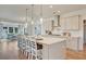 Open kitchen featuring a large island with seating, modern lighting, and stainless steel appliances at 142 Seaton St, Summerville, SC 29486