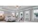 Elegant main bedroom with tray ceiling, multiple windows, and a seating area at 142 Seaton St, Summerville, SC 29486