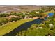 Expansive aerial view of a residential area with a golf course and winding lagoon waterways for relaxed coastal living at 15 Edgewater Aly, Isle of Palms, SC 29451