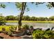 Charming backyard with Adirondack chairs and picturesque views of the pond and golf course at 15 Edgewater Aly, Isle of Palms, SC 29451