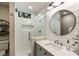 Beautiful bathroom featuring a glass shower, round mirror, and modern fixtures at 15 Edgewater Aly, Isle of Palms, SC 29451