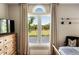 Bedroom view with a window framing a view of water and golf course at 15 Edgewater Aly, Isle of Palms, SC 29451