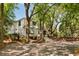Classic home surrounded by mature trees, landscaped yard, and a long driveway creating a private and serene setting at 15 Edgewater Aly, Isle of Palms, SC 29451