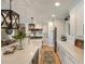 Bright kitchen with stainless steel appliances, white cabinets, marble countertops, and a large island at 15 Edgewater Aly, Isle of Palms, SC 29451