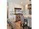 Modern kitchen with stainless steel appliances, white cabinets, and a stainless range hood at 15 Edgewater Aly, Isle of Palms, SC 29451
