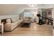 Cozy living room featuring a large sectional sofa, rustic coffee table, and workout equipment at 15 Edgewater Aly, Isle of Palms, SC 29451