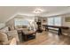 Spacious living area with ample seating, exercise equipment, and a shuffleboard table at 15 Edgewater Aly, Isle of Palms, SC 29451