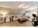 Comfortable living room area with a couch, desk, and exercise bike at 15 Edgewater Aly, Isle of Palms, SC 29451