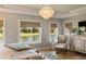 Bright main bedroom featuring a waterfront view, sitting area, and a large dresser at 15 Edgewater Aly, Isle of Palms, SC 29451