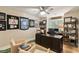 Inviting home office with a large desk, comfortable seating, and ample shelving at 15 Edgewater Aly, Isle of Palms, SC 29451