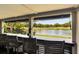 Stunning lake and golf course views from the outdoor bar area, creating the perfect spot to relax outdoors at 15 Edgewater Aly, Isle of Palms, SC 29451