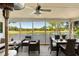 Relaxing screened patio overlooking a serene lake and golf course, perfect for outdoor dining at 15 Edgewater Aly, Isle of Palms, SC 29451