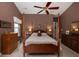 Bedroom with four-poster bed, ceiling fan and carpeted floor at 1578 Harborsun Dr, Charleston, SC 29412