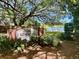 Welcoming entrance to The Commons community, featuring lush landscaping and a glimpse of the serene lake at 1578 Harborsun Dr, Charleston, SC 29412