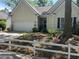 Charming single-Gathering home with a well-maintained front yard and attached garage at 1578 Harborsun Dr, Charleston, SC 29412