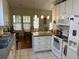 Well-lit kitchen featuring white cabinets, tile floors, and stainless steel appliances at 1578 Harborsun Dr, Charleston, SC 29412