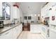 Bright kitchen with white cabinets, tile floor and stainless steel appliances at 1578 Harborsun Dr, Charleston, SC 29412