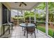 Inviting screened porch featuring a ceiling fan, tile floor, and a comfortable seating area for relaxation and enjoyment at 1578 Harborsun Dr, Charleston, SC 29412