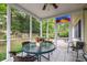 Screened porch with seating and view of backyard at 1578 Harborsun Dr, Charleston, SC 29412