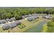 An aerial view of a neighborhood featuring beautiful homes and ponds surrounded by lush trees at 160 Cherry Grove Dr, Summerville, SC 29483